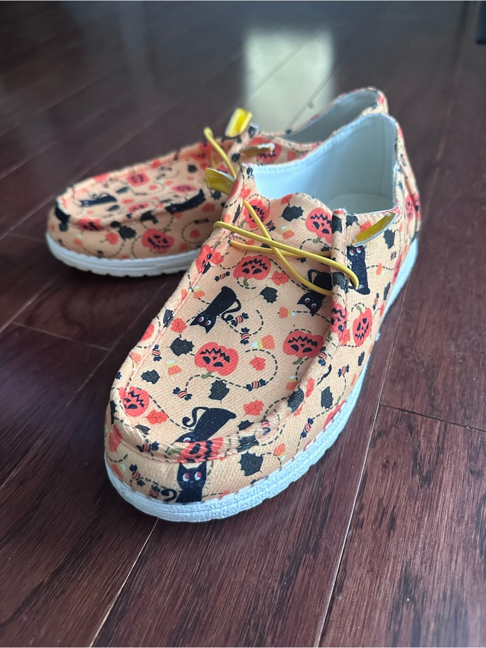Clarks Peach Halloween Moccasins with Black Cat Print and Yellow Laces